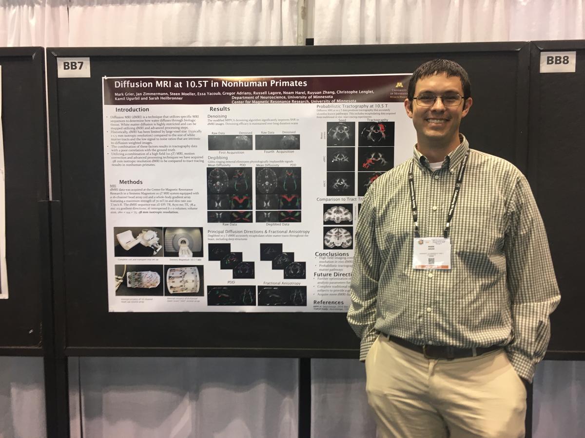 Mark Grier smiling at the camera in front of his poster titled "Diffusion MRI at 10.5T in Nonhuman Primates"